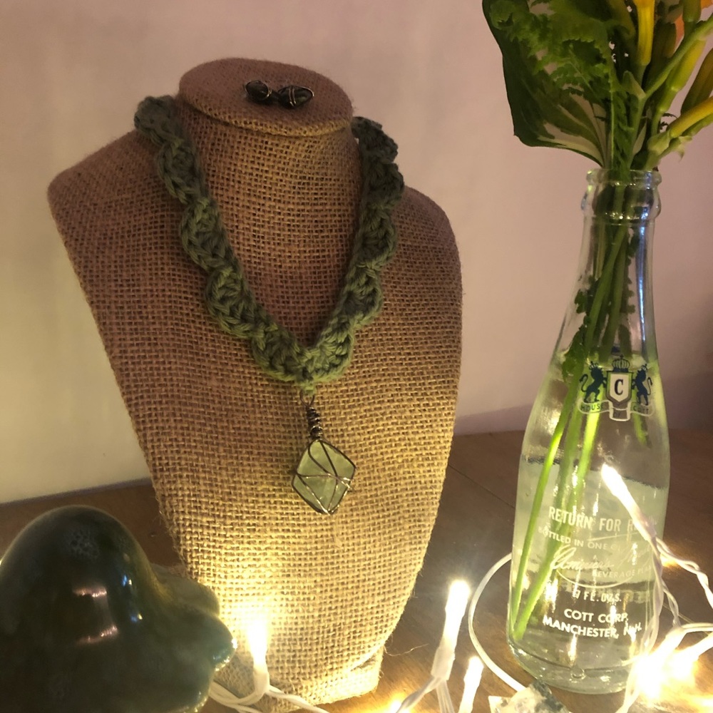 green crochet necklace with crystal pendant